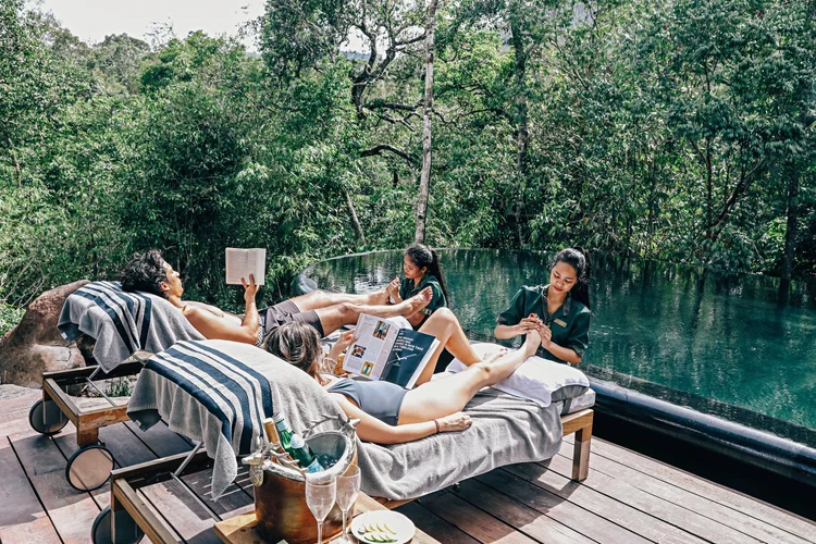 Shinta Mani Wild, Cambodia — guests at the river pool in the Cardamoms